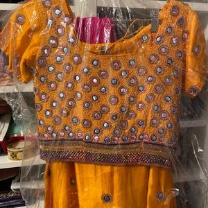Yellow and pink lehenga never worn.